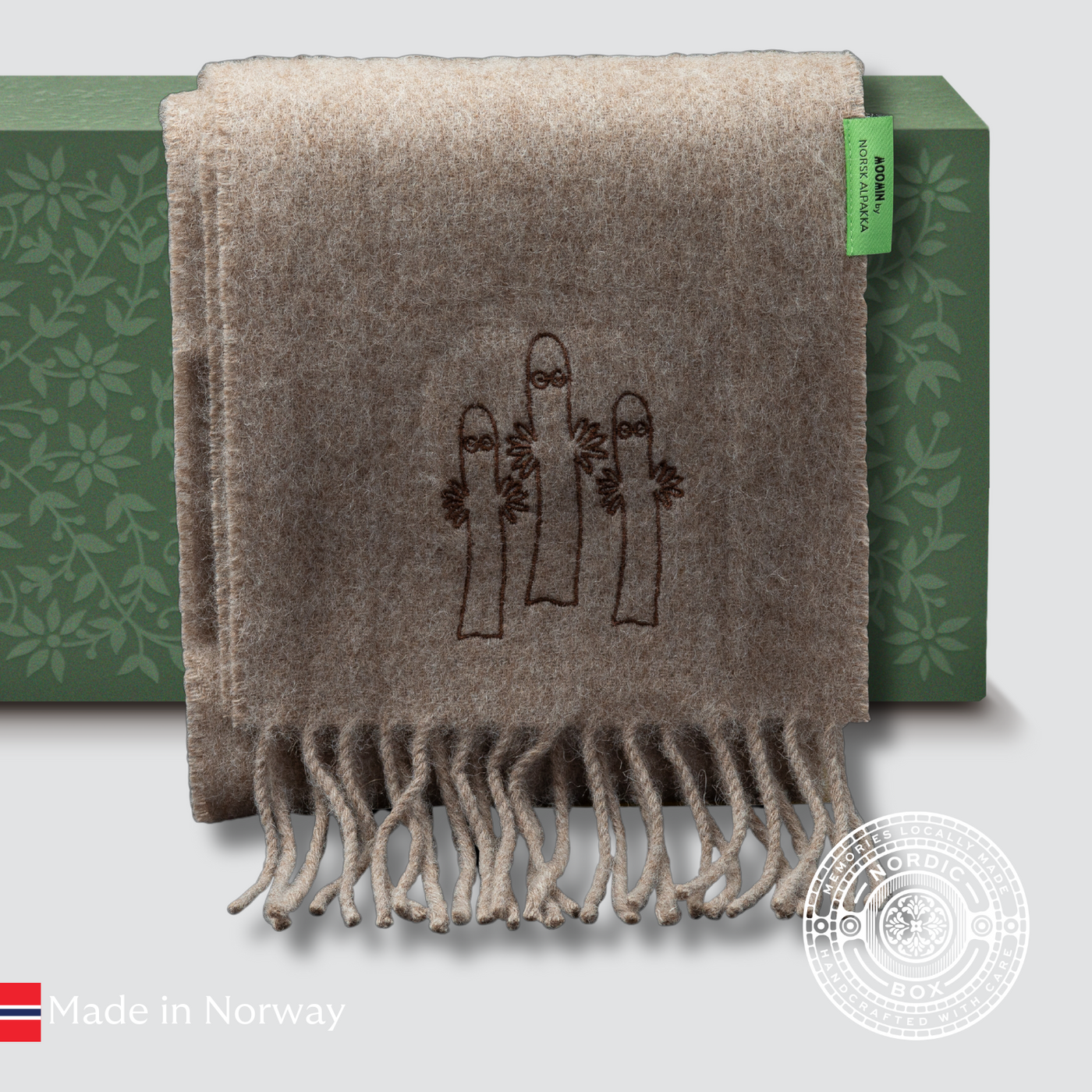 Natural brown alpaca scarf with tone-on-tone Hattifnatter embroidery, crafted in Sigdal by Norsk Alpakka.